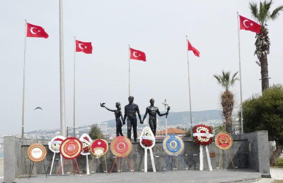 Memorial at Kusadasi with Turkish flags and commemorative wreaths