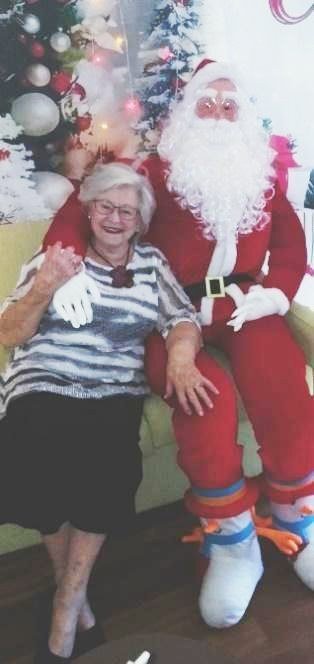 Jean seated on Santa's knee at the John Wesley