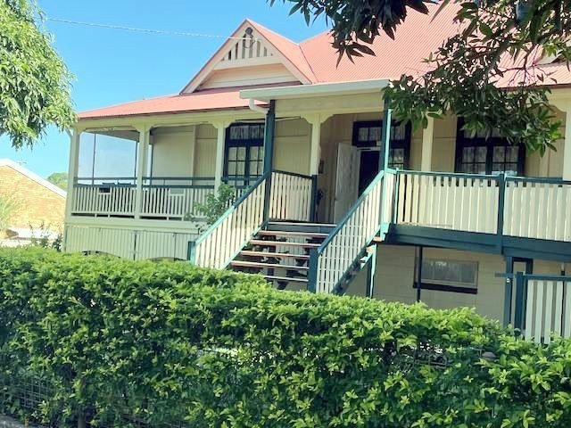 The front of Coungeau House with its verandah and stairs