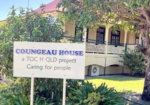 Coungeau House sign reading a Toc H QLD project, Caring for people