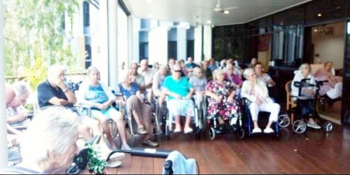 Residents of an aged care facility watching a performance