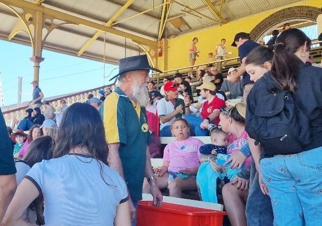Toc H volunteers and guests in the grandstand at the Ekka