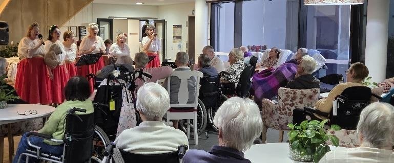 The MLOC singers performing in Christmas dress