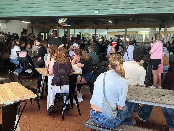 Guests seated under the marquee at the Ekka Outing